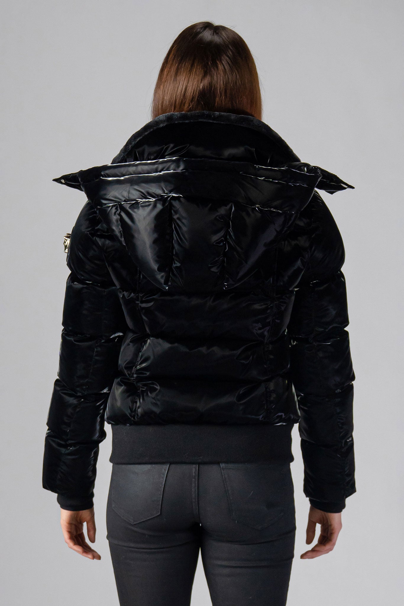 Woodpecker Women's Woody Bomber Winter coat. High-end Canadian designer winter coat for women in shiny “All Wet Black". Woodpecker cruelty-free winter coat designed in Canada. Women's heavy weight short length premium designer jacket for winter. Superior quality warm winter coat for women. Moose Knuckles, Canada Goose, Mackage, Montcler, Will Poho, Willbird, Nic Bayley. Shiny parka. Stylish winter jacket. Designer winter coat.