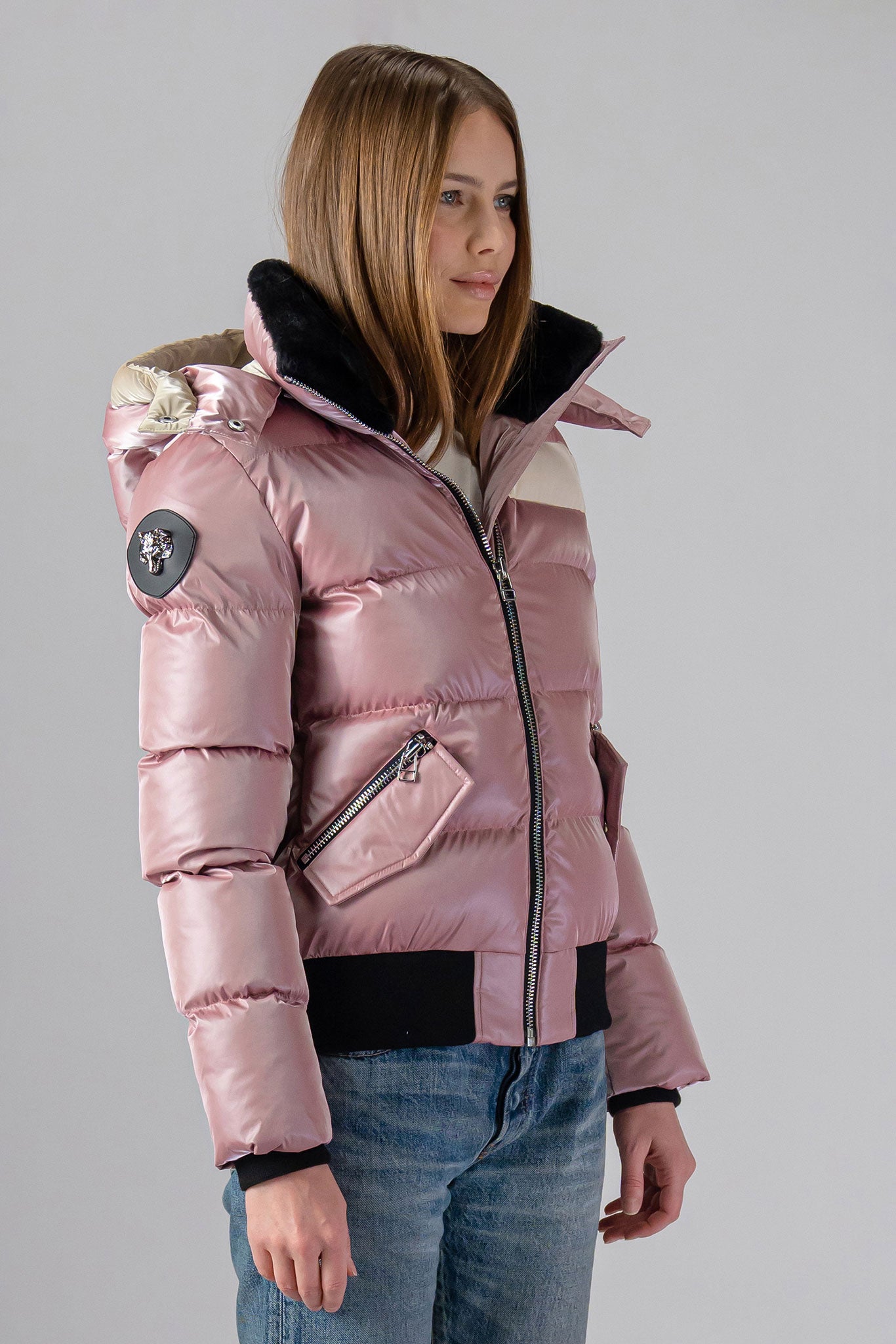 Woodpecker Women's Woody Bomber Winter coat. High-end Canadian designer winter coat for women in “Arctic Rose" colour. Woodpecker cruelty-free winter coat designed in Canada. Women's heavy weight short length premium designer jacket for winter. Superior quality warm winter coat for women. Moose Knuckles, Canada Goose, Mackage, Montcler, Will Poho, Willbird, Nic Bayley. Shiny parka. Stylish winter jacket. Designer winter coat.