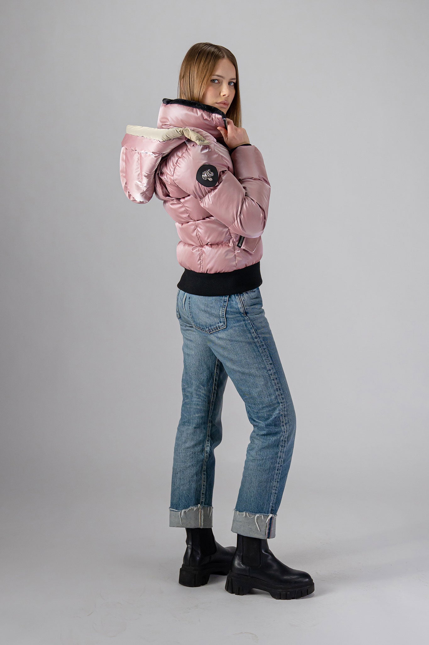 Woodpecker Women's Woody Bomber Winter coat. High-end Canadian designer winter coat for women in “Arctic Rose" colour. Woodpecker cruelty-free winter coat designed in Canada. Women's heavy weight short length premium designer jacket for winter. Superior quality warm winter coat for women. Moose Knuckles, Canada Goose, Mackage, Montcler, Will Poho, Willbird, Nic Bayley. Shiny parka. Stylish winter jacket. Designer winter coat.