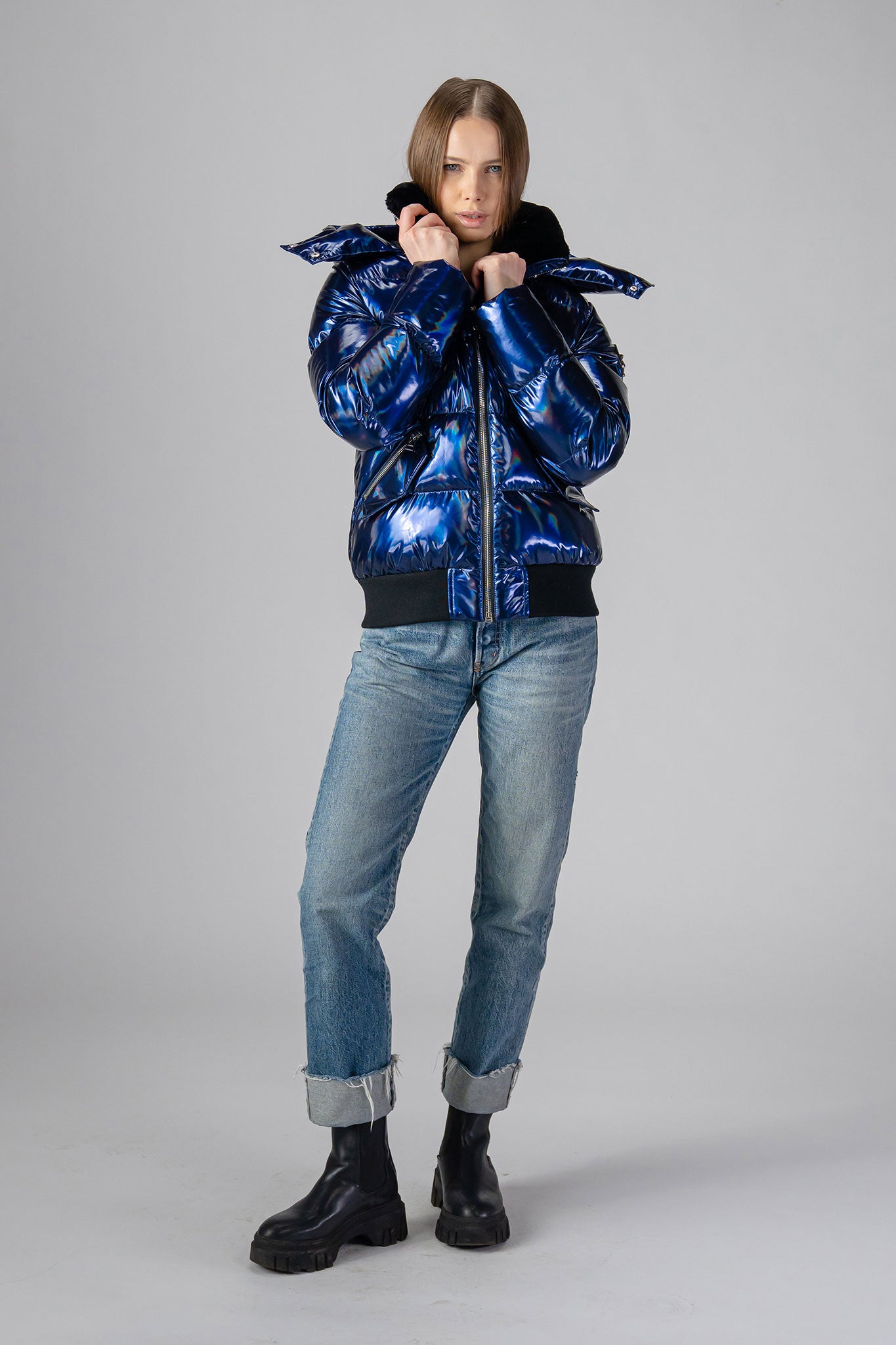 coat. High-end Canadian designer winter coat for women in "Oily Blue" colour. Woodpecker cruelty-free winter coat designed in Canada. Women's heavy weight short length premium designer jacket for winter. Superior quality warm winter coat for women. Moose Knuckles, Canada Goose, Mackage, Montcler, Will Poho, Willbird, Nic Bayley. Shiny parka. Stylish winter jacket. Designer winter coat.