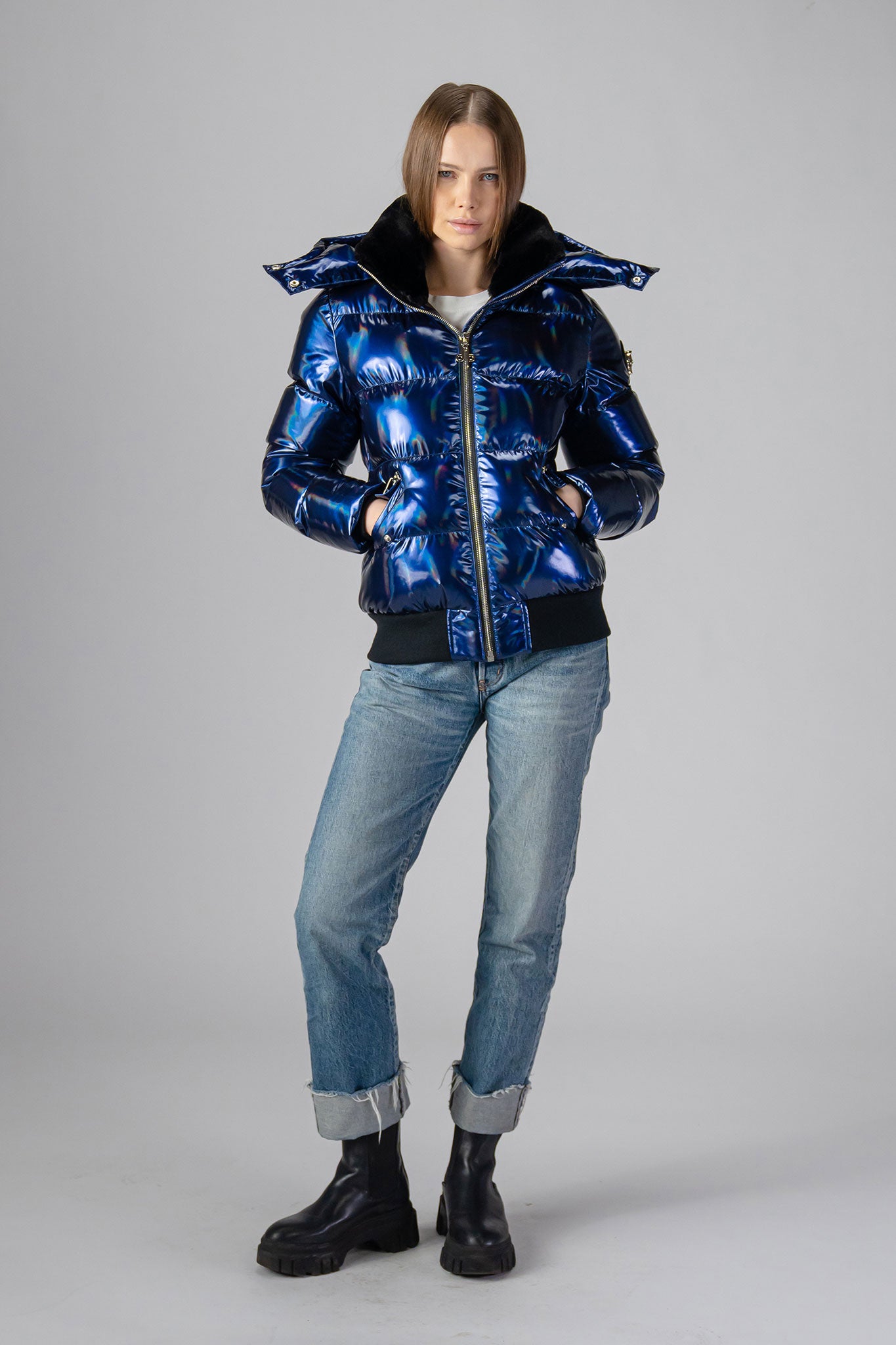 coat. High-end Canadian designer winter coat for women in "Oily Blue" colour. Woodpecker cruelty-free winter coat designed in Canada. Women's heavy weight short length premium designer jacket for winter. Superior quality warm winter coat for women. Moose Knuckles, Canada Goose, Mackage, Montcler, Will Poho, Willbird, Nic Bayley. Shiny parka. Stylish winter jacket. Designer winter coat.