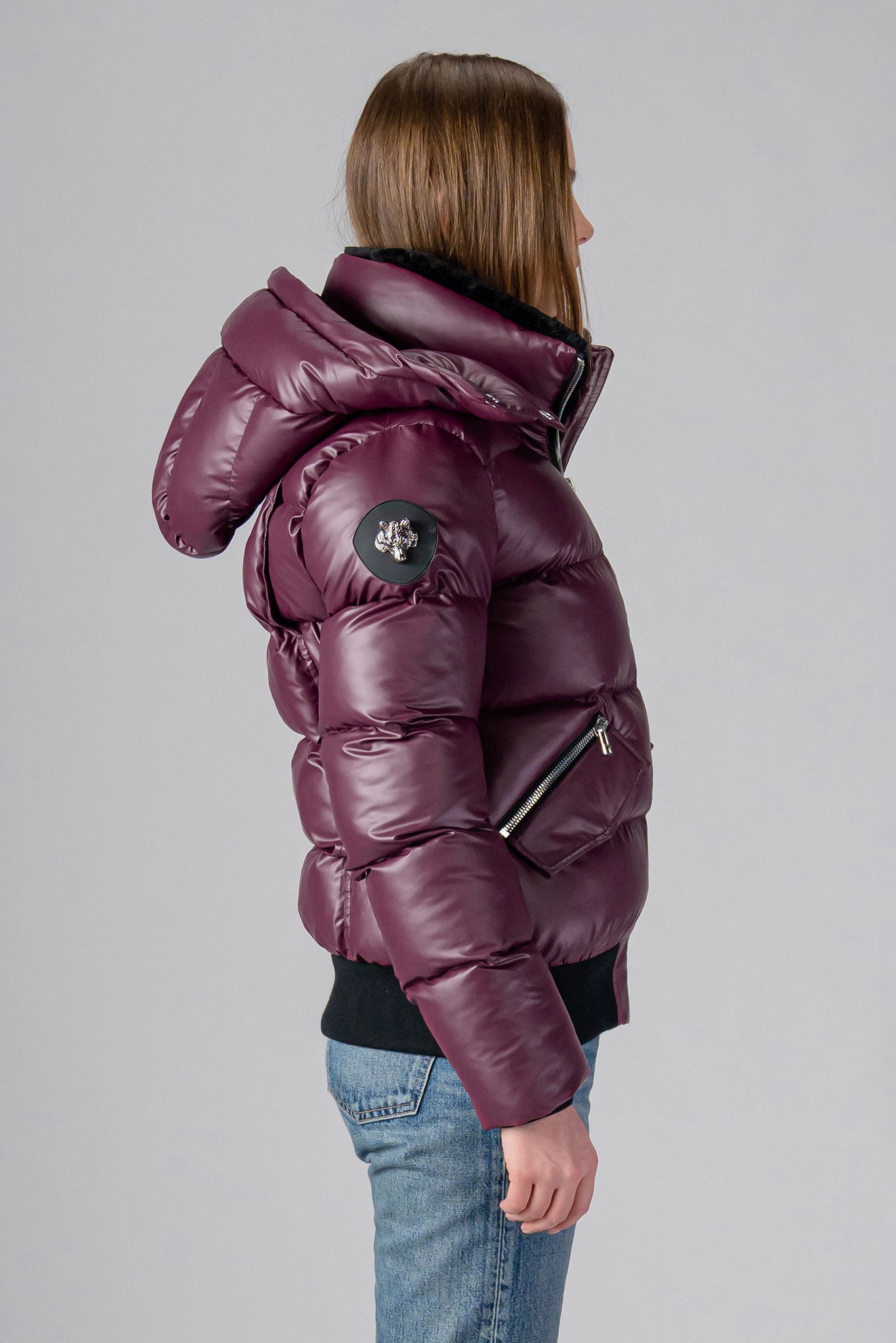 Woodpecker Women's Woody Bomber Winter coat. High-end Canadian designer winter coat for women in "Plum" colour. Woodpecker cruelty-free winter coat designed in Canada. Women's heavy weight short length premium designer jacket for winter. Superior quality warm winter coat for women. Moose Knuckles, Canada Goose, Mackage, Montcler, Will Poho, Willbird, Nic Bayley. Shiny parka. Stylish winter jacket. Designer winter coat.