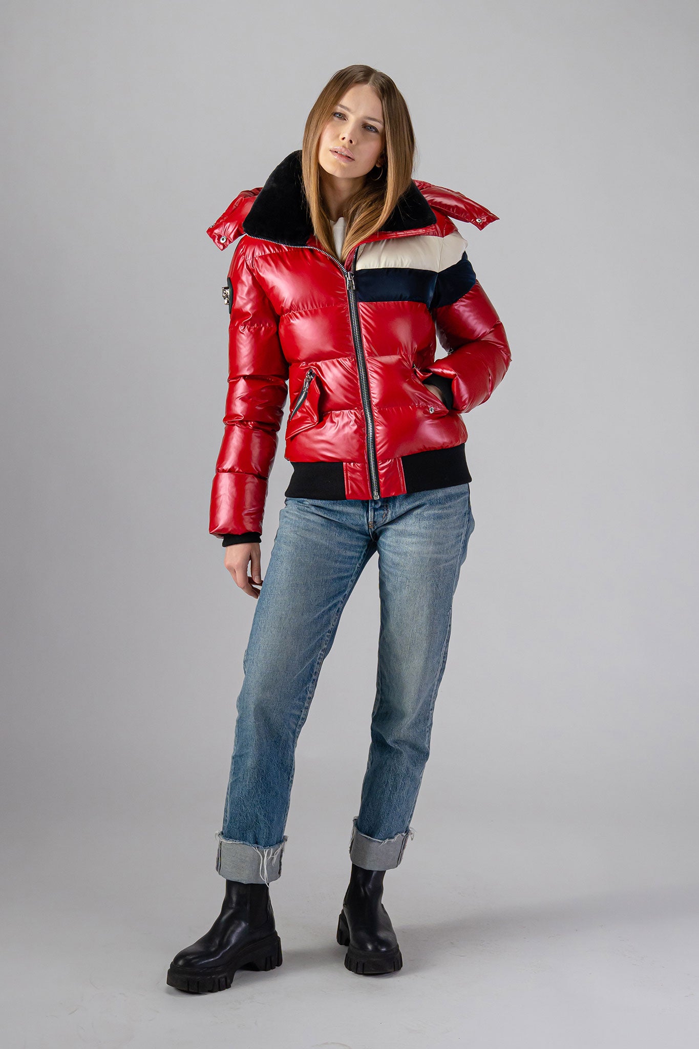 Woodpecker Women's Woody Bomber Winter coat. High-end Canadian designer winter coat for women in "Red White Blue" colour. Woodpecker cruelty-free winter coat designed in Canada. Women's heavy weight short length premium designer jacket for winter. Superior quality warm winter coat for women. Moose Knuckles, Canada Goose, Mackage, Montcler, Will Poho, Willbird, Nic Bayley. Shiny parka. Stylish winter jacket. Designer winter coat.