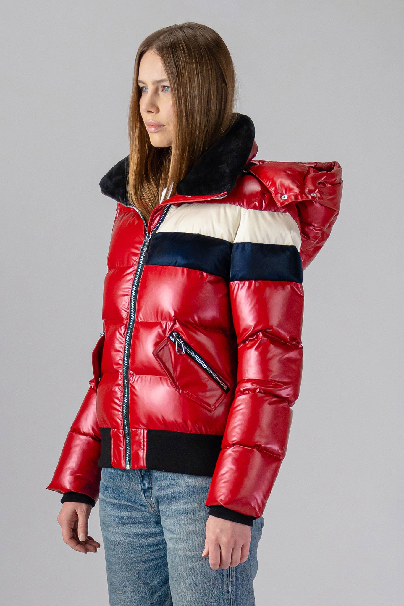 Woodpecker Women's Woody Bomber Winter coat. High-end Canadian designer winter coat for women in "Red White Blue" colour. Woodpecker cruelty-free winter coat designed in Canada. Women's heavy weight short length premium designer jacket for winter. Superior quality warm winter coat for women. Moose Knuckles, Canada Goose, Mackage, Montcler, Will Poho, Willbird, Nic Bayley. Shiny parka. Stylish winter jacket. Designer winter coat.