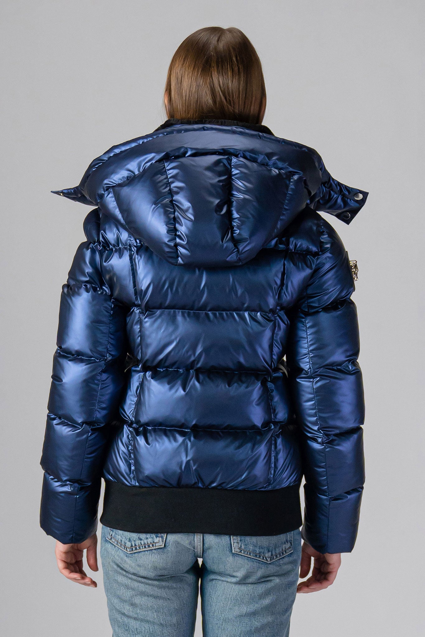 Woodpecker Women's Woody Bomber Winter coat. High-end Canadian designer winter coat for women in "Sapphire" colour. Woodpecker cruelty-free winter coat designed in Canada. Women's heavy weight short length premium designer jacket for winter. Superior quality warm winter coat for women. Moose Knuckles, Canada Goose, Mackage, Montcler, Will Poho, Willbird, Nic Bayley. Shiny parka. Stylish winter jacket. Designer winter coat.