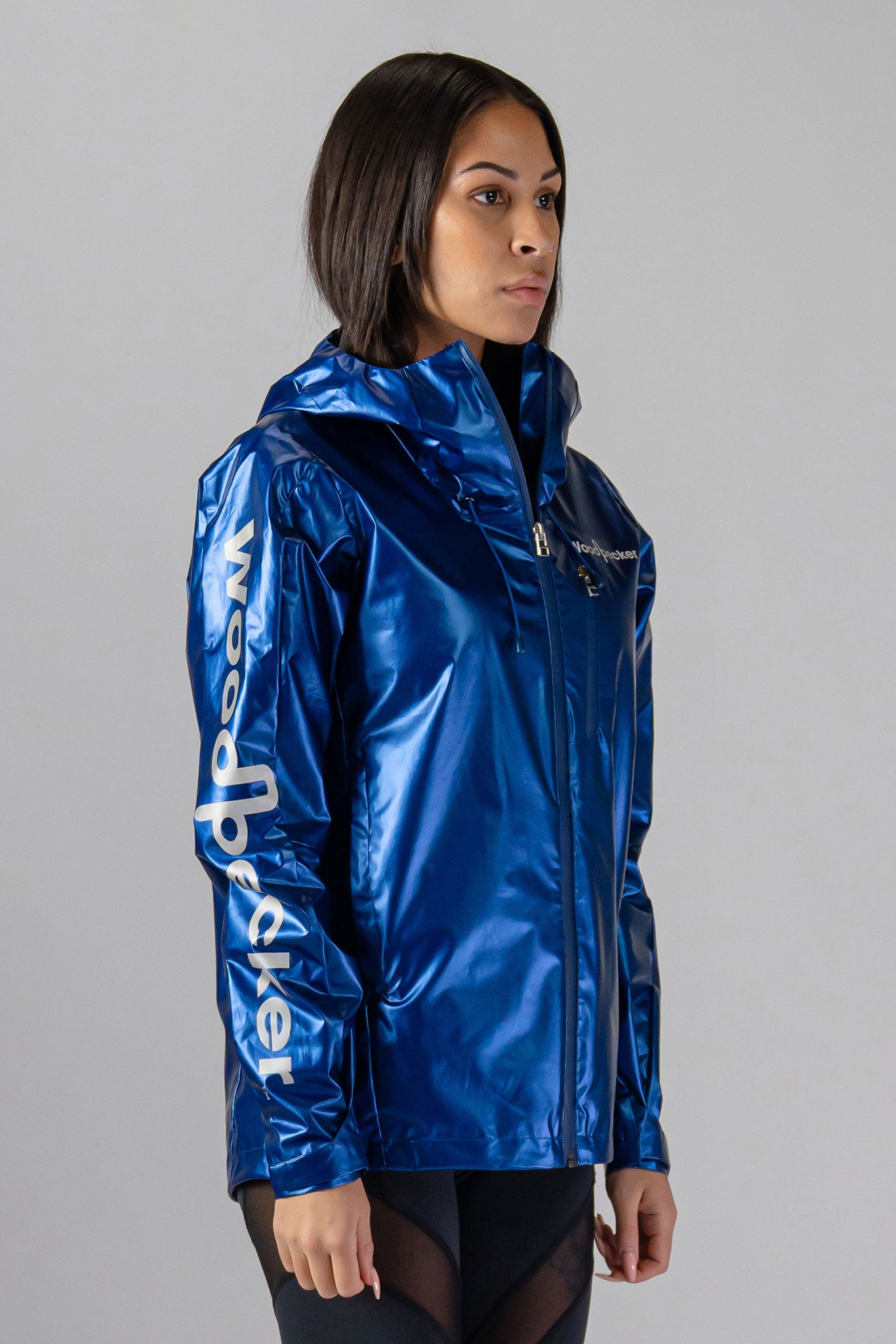 Woodpecker Women's Wind Shell coat. High-end Canadian designer activewear coat for women in "Flash Blue" colour. Woodpecker coat designed in Canada. Moose Knuckles, Canada Goose, Mackage, Montcler, Will Poho, Willbird, Nic Bayley.
