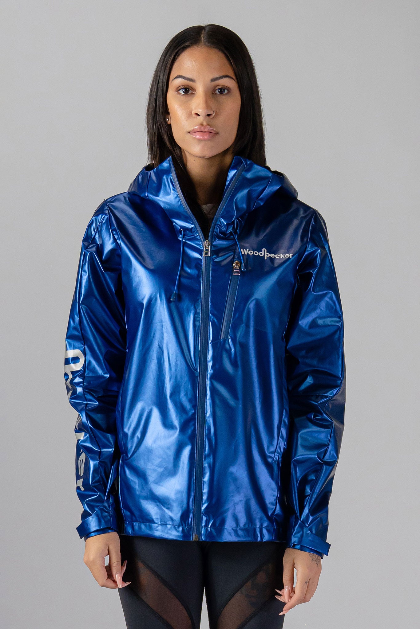 Woodpecker Women's Wind Shell coat. High-end Canadian designer activewear coat for women in "Flash Blue" colour. Woodpecker coat designed in Canada. Moose Knuckles, Canada Goose, Mackage, Montcler, Will Poho, Willbird, Nic Bayley.