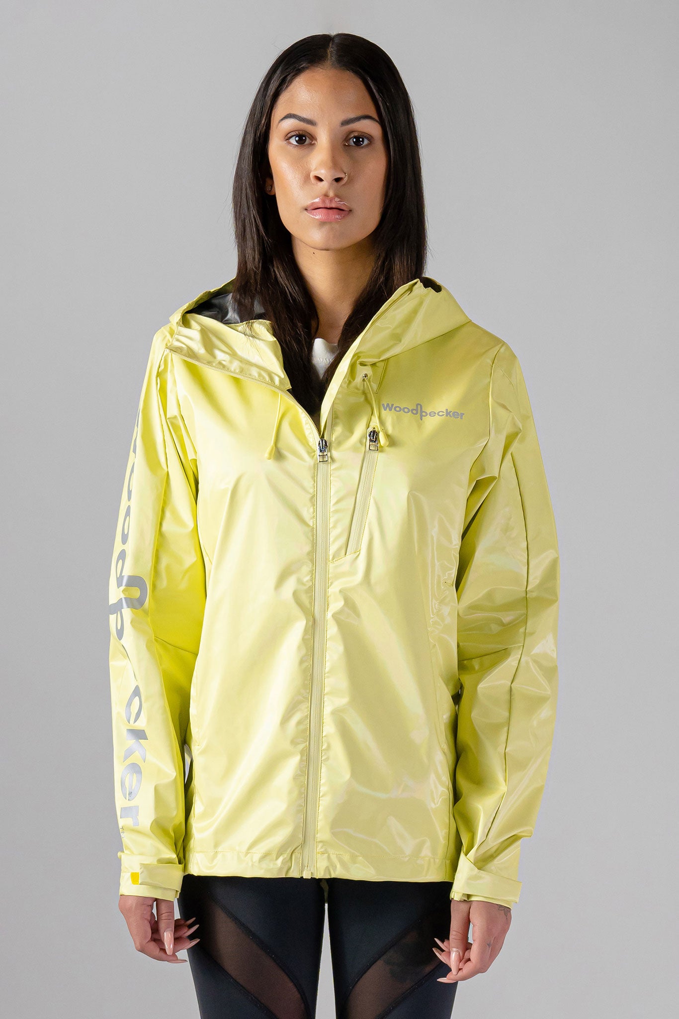 Woodpecker Women's Wind Shell coat. High-end Canadian designer activewear coat for women in "Mellow Yellow" colour. Woodpecker coat designed in Canada. Moose Knuckles, Canada Goose, Mackage, Montcler, Will Poho, Willbird, Nic Bayley.