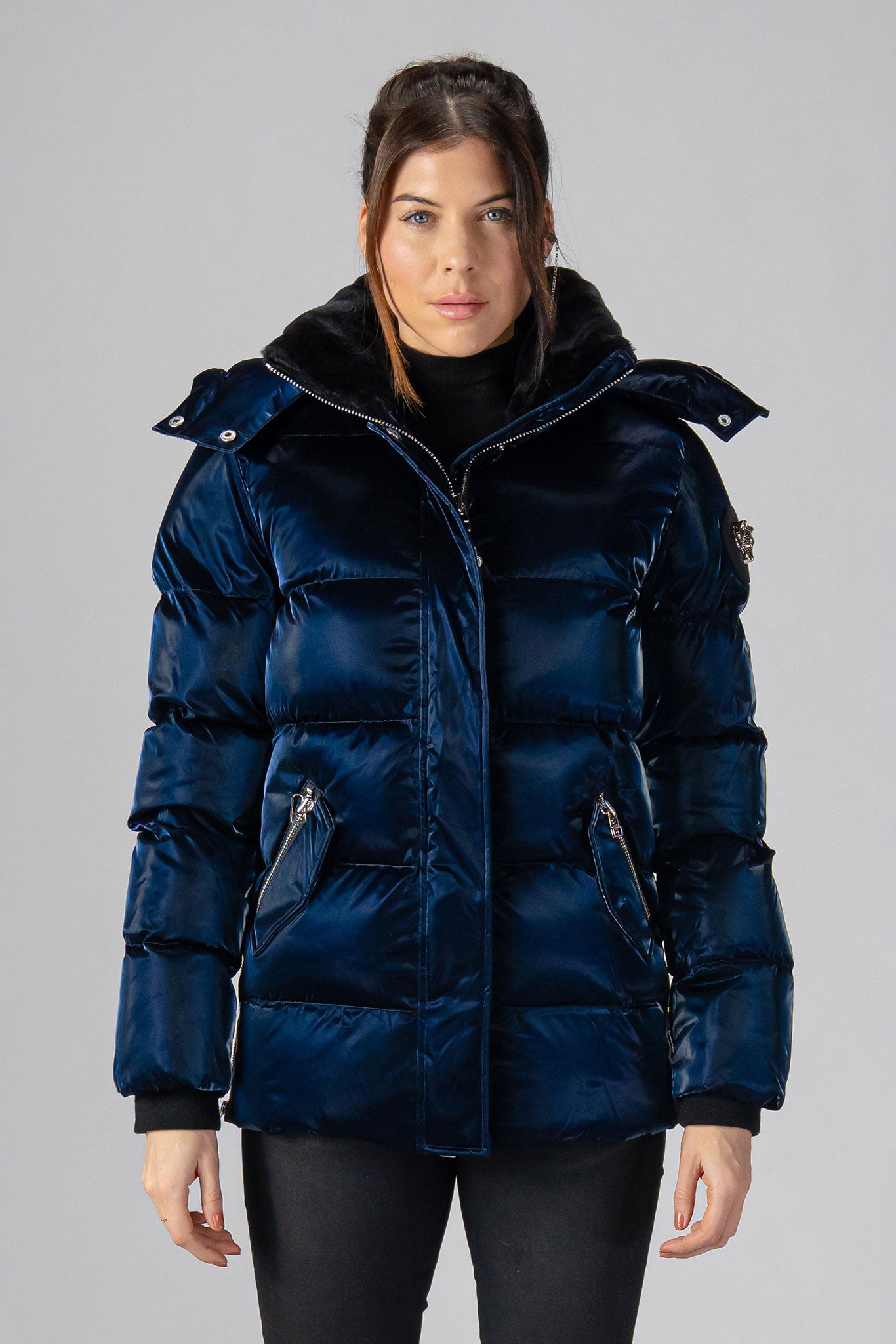 Woodpecker Women's Bumnester Winter coat. High-end Canadian designer winter coat for women in shiny "All Wet Navy" colour. Woodpecker cruelty-free winter coat designed in Canada. Women's heavy weight medium length premium designer jacket for winter. Superior quality warm winter coat for women. Moose Knuckles, Canada Goose, Mackage, Montcler, Will Poho, Willbird, Nic Bayley. Extra warm. Shiny parka. Stylish winter jacket. Designer winter coat.