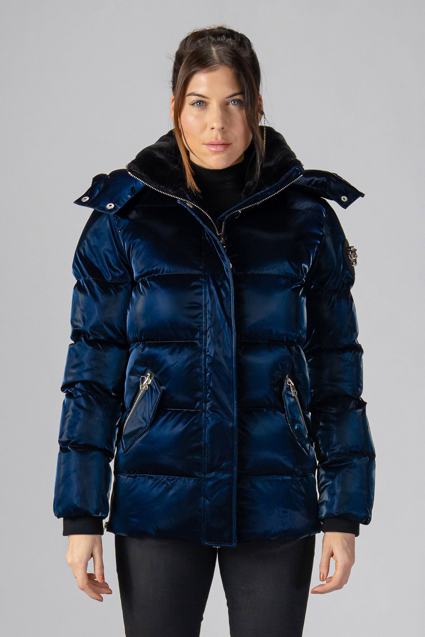 Woodpecker Women's Bumnester Winter coat. High-end Canadian designer winter coat for women in shiny "All Wet Navy" colour. Woodpecker cruelty-free winter coat designed in Canada. Women's heavy weight medium length premium designer jacket for winter. Superior quality warm winter coat for women. Moose Knuckles, Canada Goose, Mackage, Montcler, Will Poho, Willbird, Nic Bayley. Extra warm. Shiny parka. Stylish winter jacket. Designer winter coat.