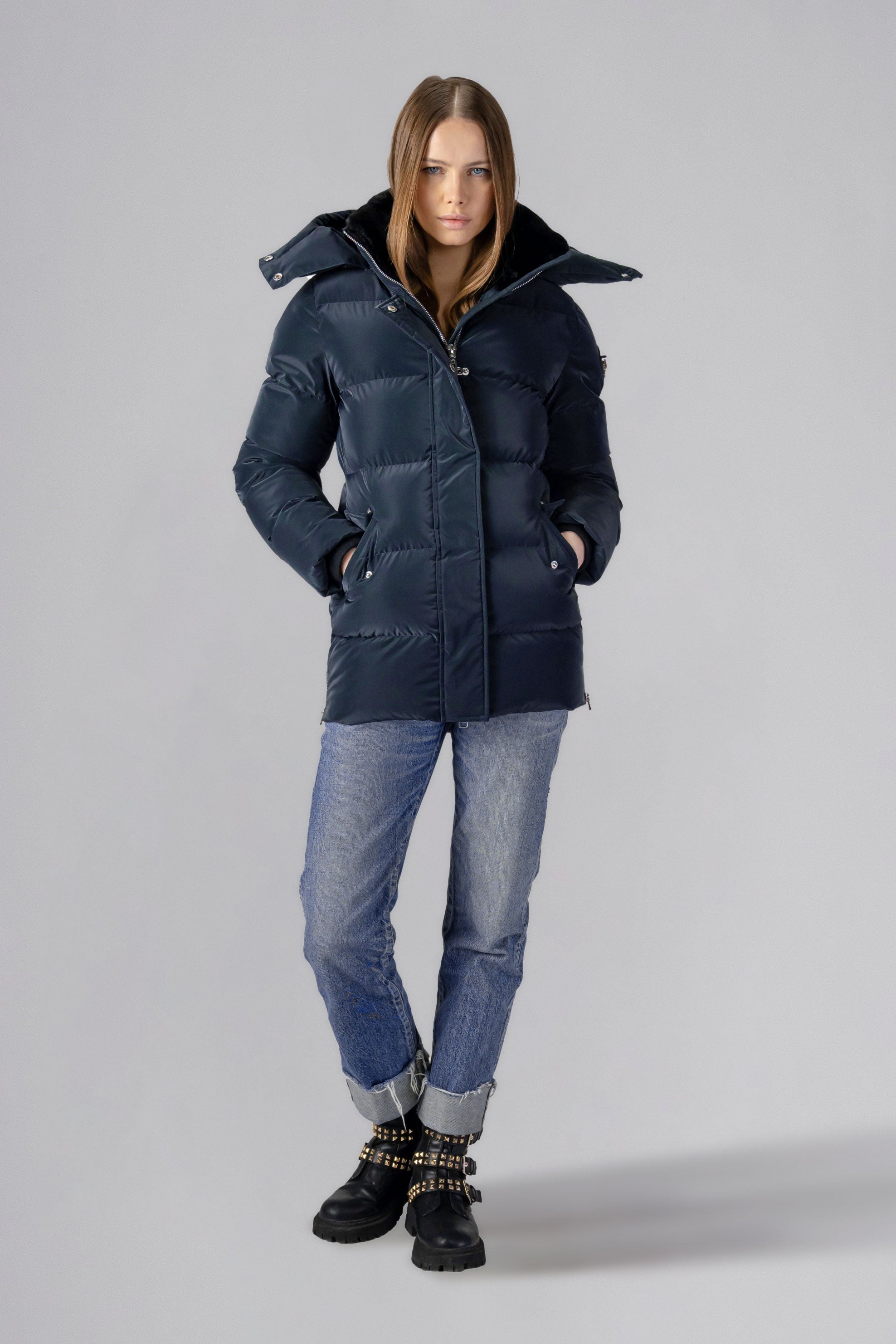 Woodpecker Women's Bumnester Winter coat. High-end Canadian designer winter coat for women in shiny "Blue Diamond" colour. Woodpecker cruelty-free winter coat designed in Canada. Women's heavy weight medium length premium designer jacket for winter. Superior quality warm winter coat for women. Moose Knuckles, Canada Goose, Mackage, Montcler, Will Poho, Willbird, Nic Bayley. Extra warm. Shiny parka. Stylish winter jacket. Designer winter coat.