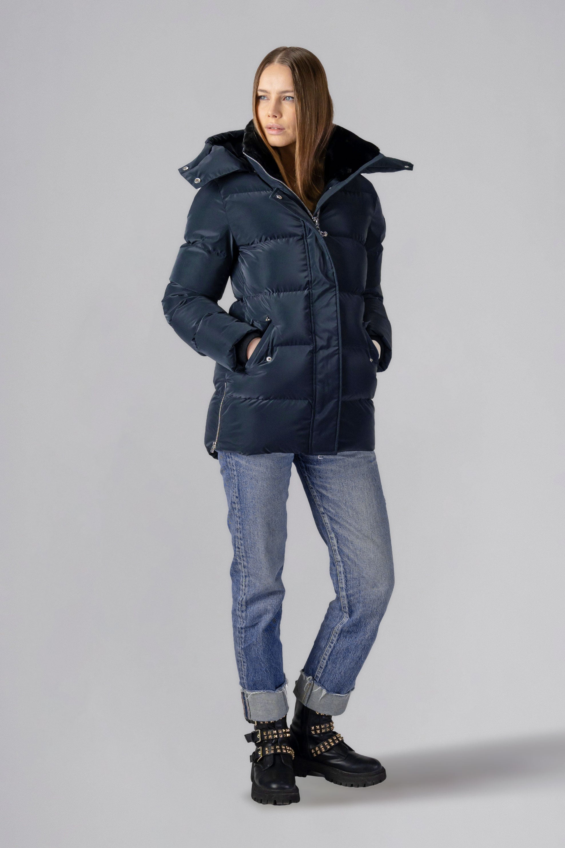 Woodpecker Women's Bumnester Winter coat. High-end Canadian designer winter coat for women in shiny "Blue Diamond" colour. Woodpecker cruelty-free winter coat designed in Canada. Women's heavy weight medium length premium designer jacket for winter. Superior quality warm winter coat for women. Moose Knuckles, Canada Goose, Mackage, Montcler, Will Poho, Willbird, Nic Bayley. Extra warm. Shiny parka. Stylish winter jacket. Designer winter coat.