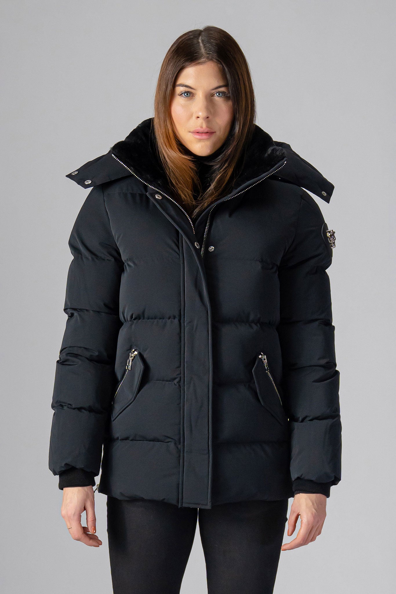 Woodpecker Women's Bumnester Winter coat. High-end Canadian designer winter coat for women in "Matte Black" colour. Woodpecker cruelty-free winter coat designed in Canada. Women's heavy weight medium length premium designer jacket for winter. Superior quality warm winter coat for women. Moose Knuckles, Canada Goose, Mackage, Montcler, Will Poho, Willbird, Nic Bayley. Extra warm. Shiny parka. Stylish winter jacket. Designer winter coat.