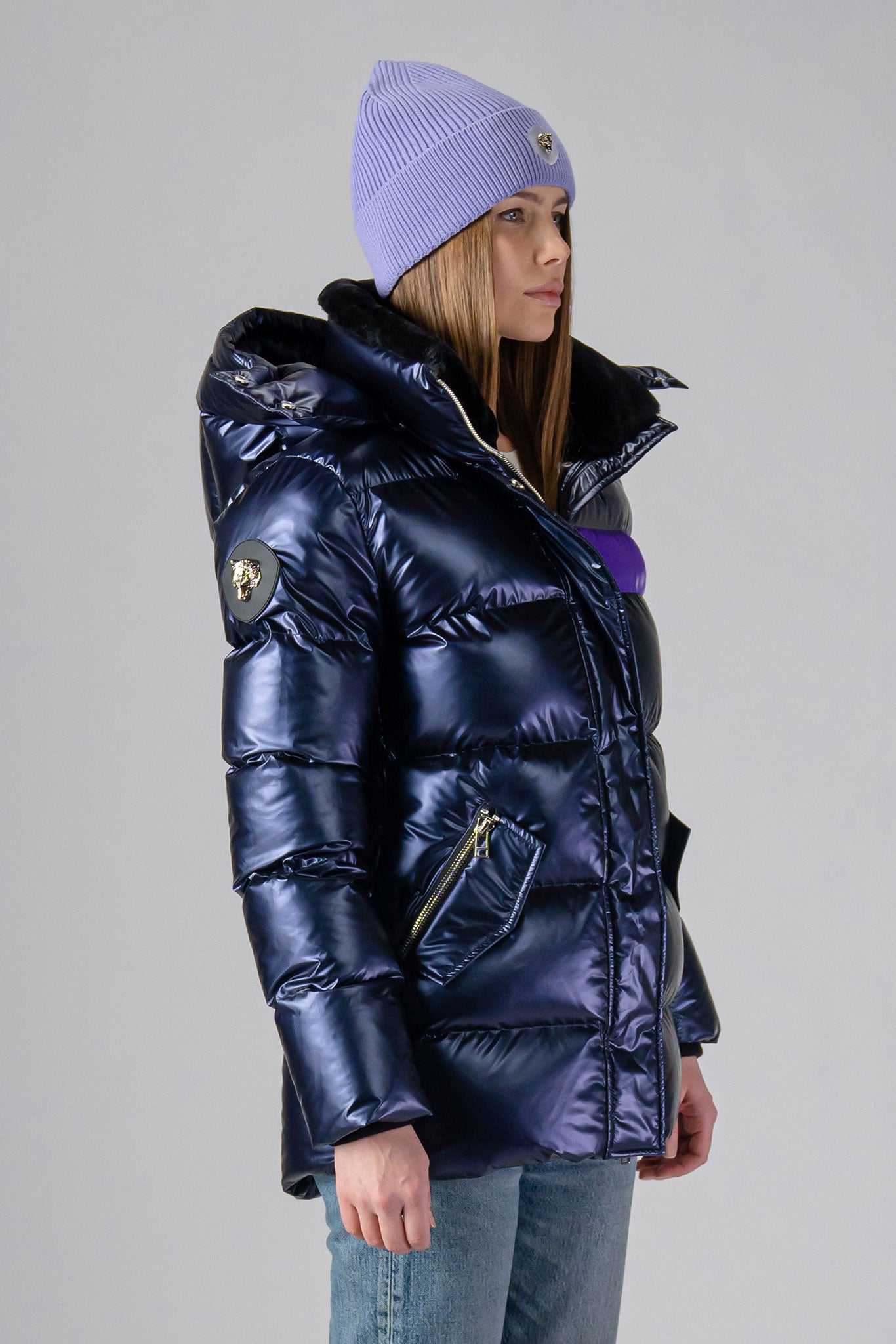 Woodpecker Women's Bumnester Winter coat. High-end Canadian designer winter coat for women in shiny "Sapphire/Silver/Purple" colour. Woodpecker cruelty-free winter coat designed in Canada. Women's heavy weight medium length premium designer jacket for winter. Superior quality warm winter coat for women. Moose Knuckles, Canada Goose, Mackage, Montcler, Will Poho, Willbird, Nic Bayley. Extra warm. Shiny parka. Stylish winter jacket. Designer winter coat.