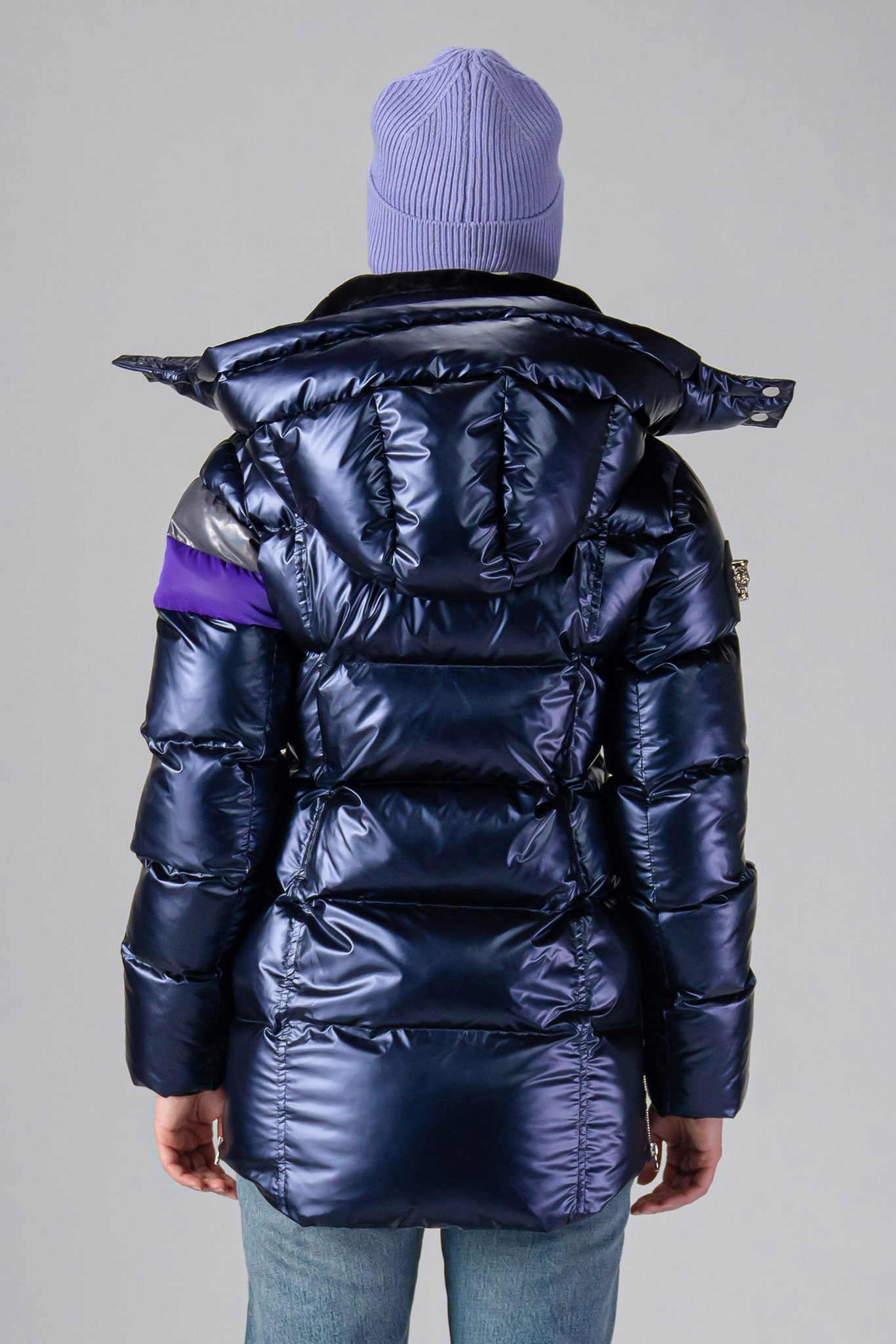 Woodpecker Women's Bumnester Winter coat. High-end Canadian designer winter coat for women in shiny "Sapphire/Silver/Purple" colour. Woodpecker cruelty-free winter coat designed in Canada. Women's heavy weight medium length premium designer jacket for winter. Superior quality warm winter coat for women. Moose Knuckles, Canada Goose, Mackage, Montcler, Will Poho, Willbird, Nic Bayley. Extra warm. Shiny parka. Stylish winter jacket. Designer winter coat.