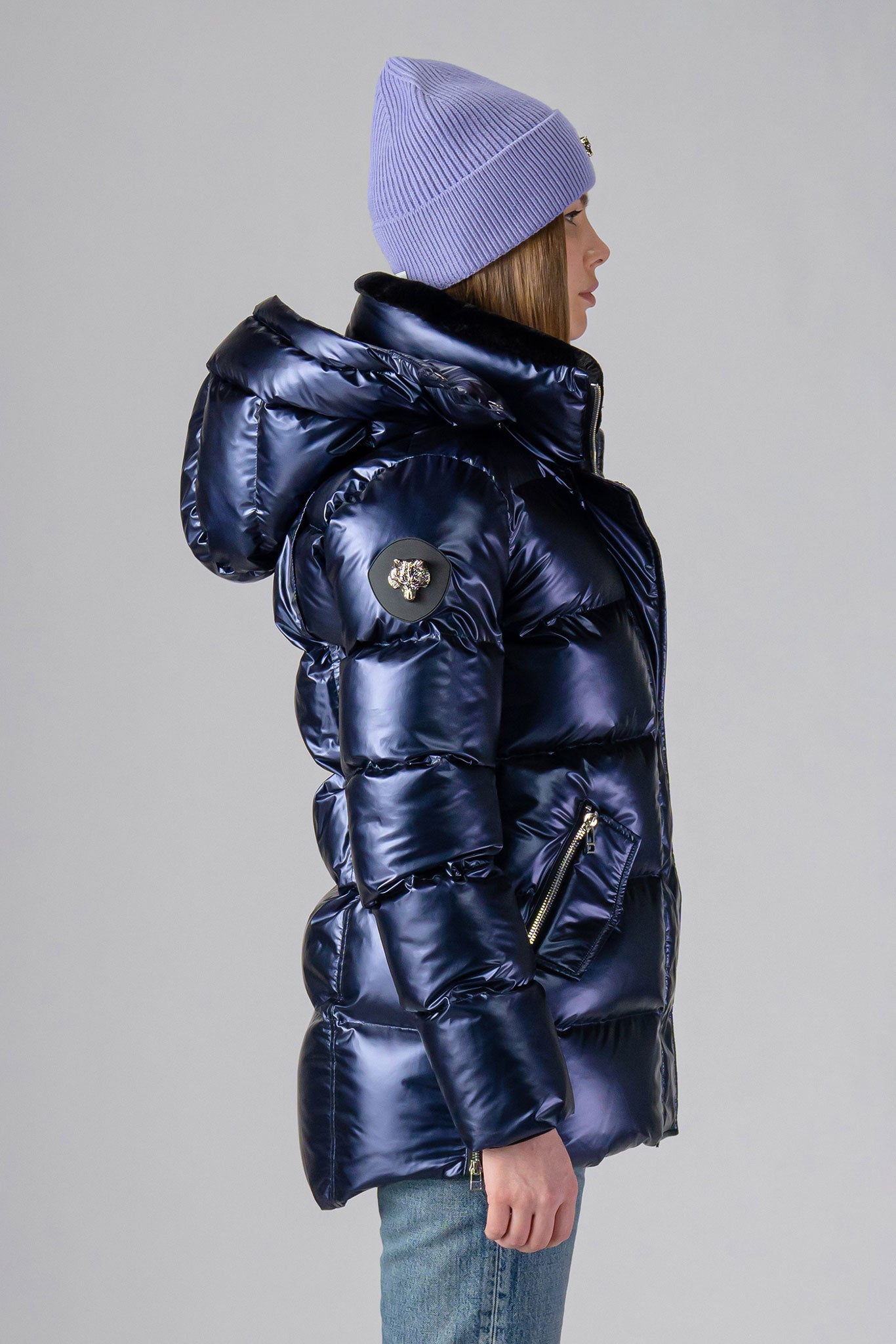 Woodpecker Women's Bumnester Winter coat. High-end Canadian designer winter coat for women in shiny "Sapphire/Silver/Purple" colour. Woodpecker cruelty-free winter coat designed in Canada. Women's heavy weight medium length premium designer jacket for winter. Superior quality warm winter coat for women. Moose Knuckles, Canada Goose, Mackage, Montcler, Will Poho, Willbird, Nic Bayley. Extra warm. Shiny parka. Stylish winter jacket. Designer winter coat.