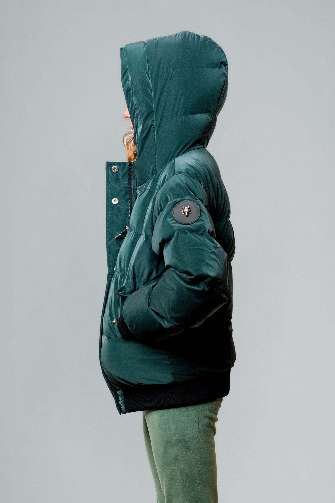 Woodpecker Kids' Chickadee Winter coat. High-end Canadian designer winter coat for Kids in "Green Diamond" colour. Woodpecker cruelty-free winter coat designed in Canada. Kids' heavy weight short length premium designer jacket for winter. Superior quality warm winter coat for kids. Moose Knuckles, Canada Goose, Mackage, Montcler, Will Poho, Willbird, Nic Bayley. Extra warm. Shiny parka. Stylish winter jacket. Designer winter coat.