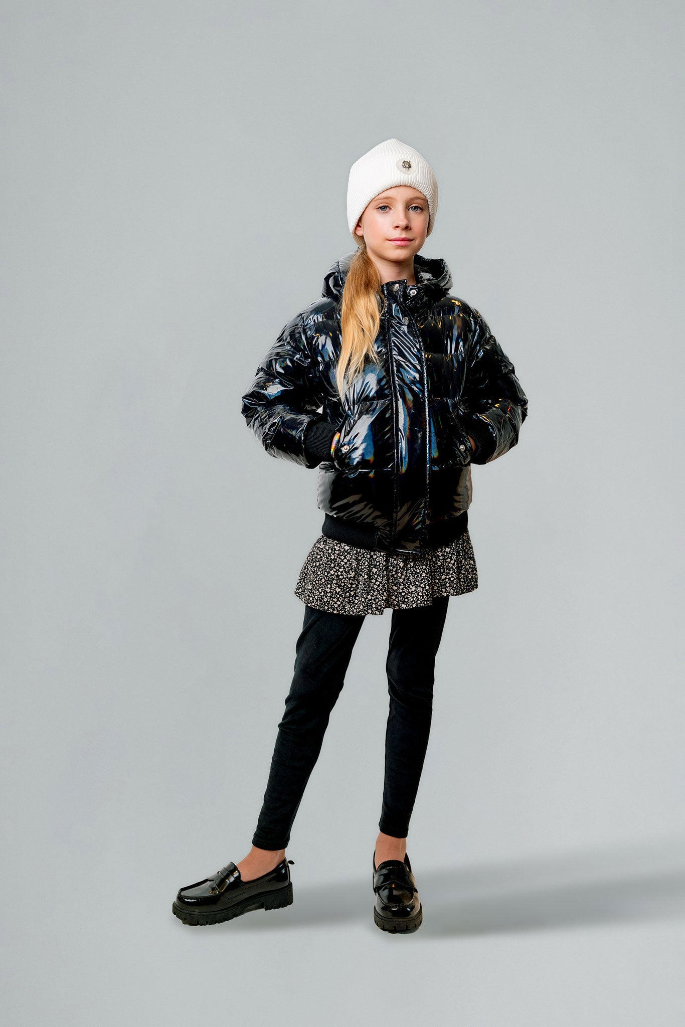 Woodpecker Kids' Chickadee Winter coat. High-end Canadian designer winter coat for Kids in "Oily Black" colour. Woodpecker cruelty-free winter coat designed in Canada. Kids' heavy weight short length premium designer jacket for winter. Superior quality warm winter coat for kids. Moose Knuckles, Canada Goose, Mackage, Montcler, Will Poho, Willbird, Nic Bayley. Extra Warm. Shiny parka. Stylish winter jacket. Designer winter coat.