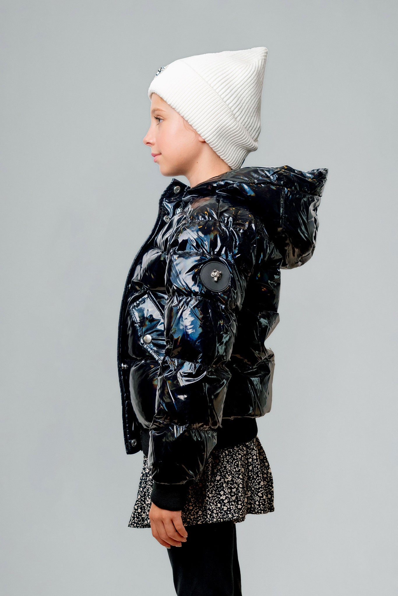 Woodpecker Kids' Chickadee Winter coat. High-end Canadian designer winter coat for Kids in "Oily Black" colour. Woodpecker cruelty-free winter coat designed in Canada. Kids' heavy weight short length premium designer jacket for winter. Superior quality warm winter coat for kids. Moose Knuckles, Canada Goose, Mackage, Montcler, Will Poho, Willbird, Nic Bayley. Extra Warm. Shiny parka. Stylish winter jacket. Designer winter coat.