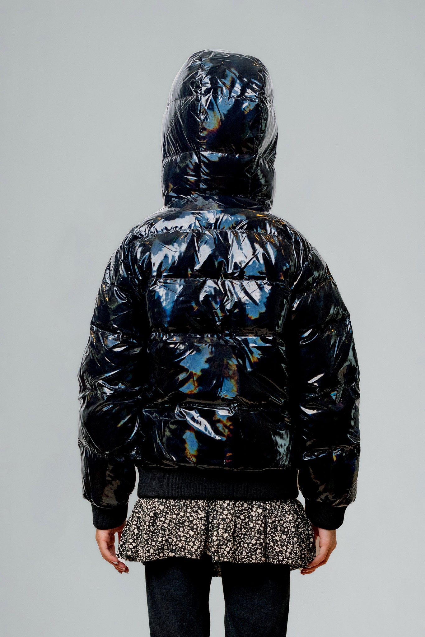 Woodpecker Kids' Chickadee Winter coat. High-end Canadian designer winter coat for Kids in "Oily Black" colour. Woodpecker cruelty-free winter coat designed in Canada. Kids' heavy weight short length premium designer jacket for winter. Superior quality warm winter coat for kids. Moose Knuckles, Canada Goose, Mackage, Montcler, Will Poho, Willbird, Nic Bayley. Extra Warm. Shiny parka. Stylish winter jacket. Designer winter coat.