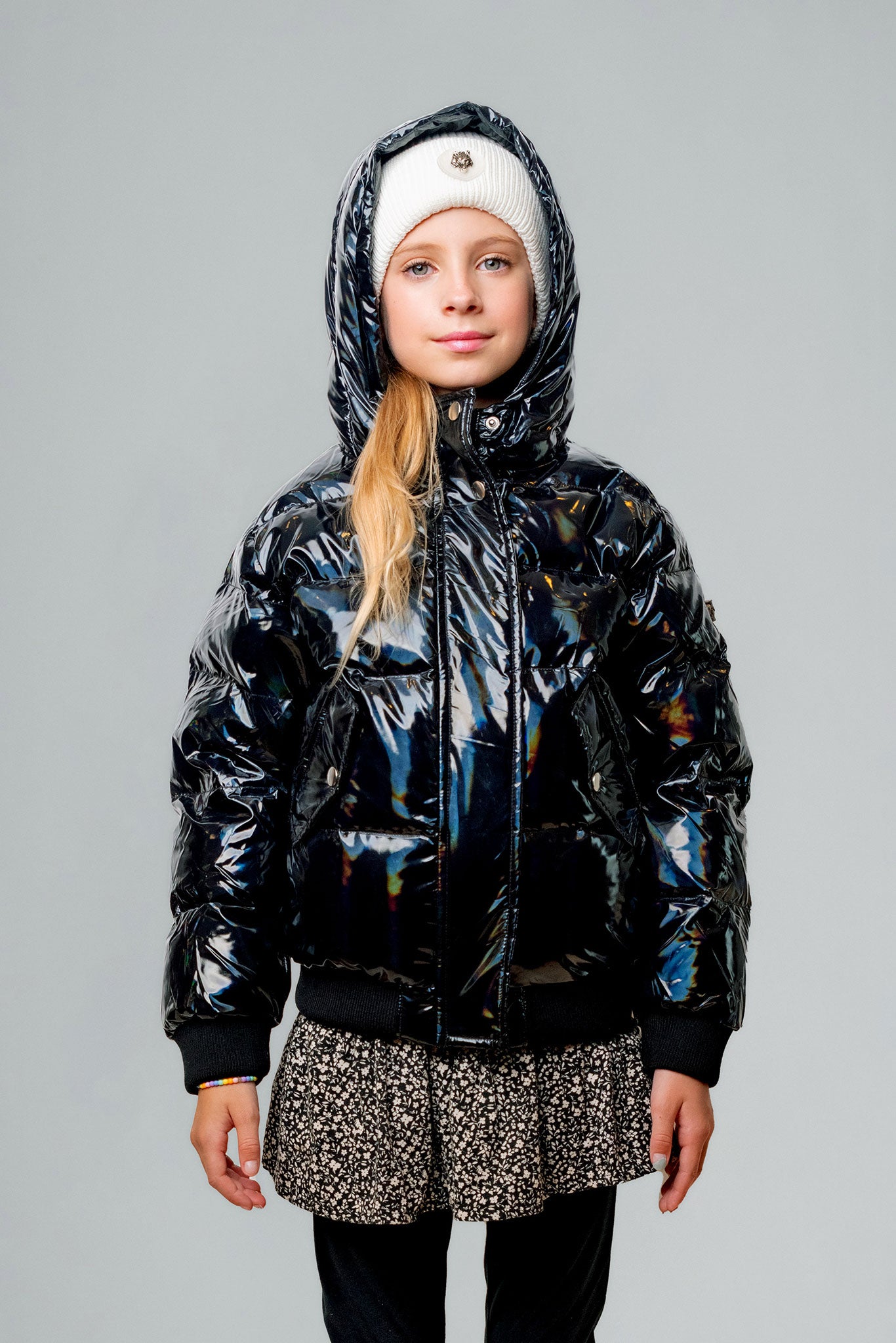 Woodpecker Kids' Chickadee Winter coat. High-end Canadian designer winter coat for Kids in "Oily Black" colour. Woodpecker cruelty-free winter coat designed in Canada. Kids' heavy weight short length premium designer jacket for winter. Superior quality warm winter coat for kids. Moose Knuckles, Canada Goose, Mackage, Montcler, Will Poho, Willbird, Nic Bayley. Extra Warm. Shiny parka. Stylish winter jacket. Designer winter coat.