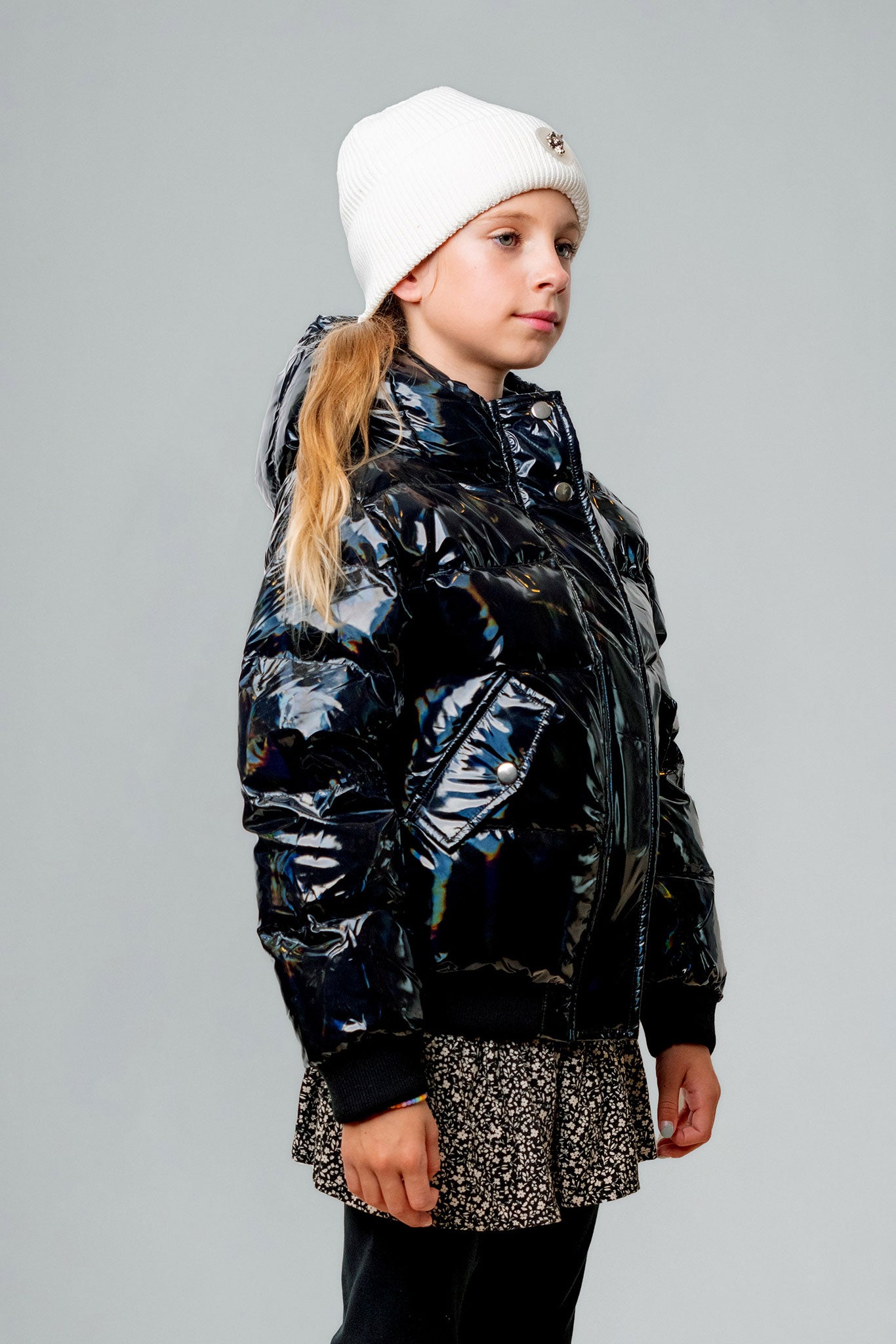 Woodpecker Kids' Chickadee Winter coat. High-end Canadian designer winter coat for Kids in "Oily Black" colour. Woodpecker cruelty-free winter coat designed in Canada. Kids' heavy weight short length premium designer jacket for winter. Superior quality warm winter coat for kids. Moose Knuckles, Canada Goose, Mackage, Montcler, Will Poho, Willbird, Nic Bayley. Extra Warm. Shiny parka. Stylish winter jacket. Designer winter coat.