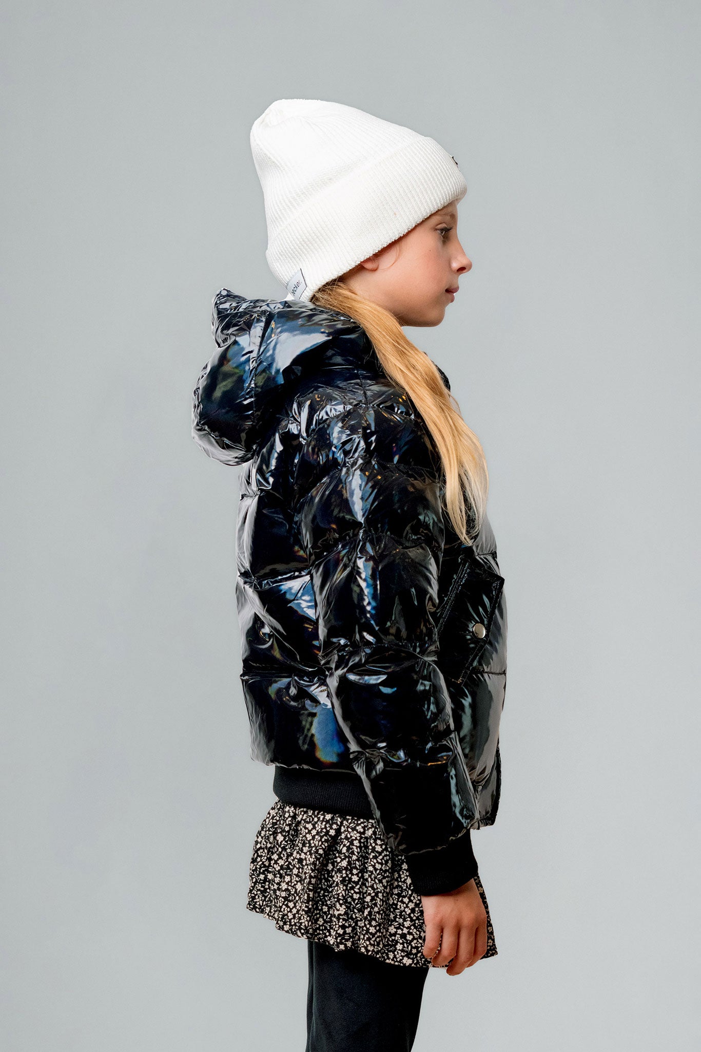 Woodpecker Kids' Chickadee Winter coat. High-end Canadian designer winter coat for Kids in "Oily Black" colour. Woodpecker cruelty-free winter coat designed in Canada. Kids' heavy weight short length premium designer jacket for winter. Superior quality warm winter coat for kids. Moose Knuckles, Canada Goose, Mackage, Montcler, Will Poho, Willbird, Nic Bayley. Extra Warm. Shiny parka. Stylish winter jacket. Designer winter coat.