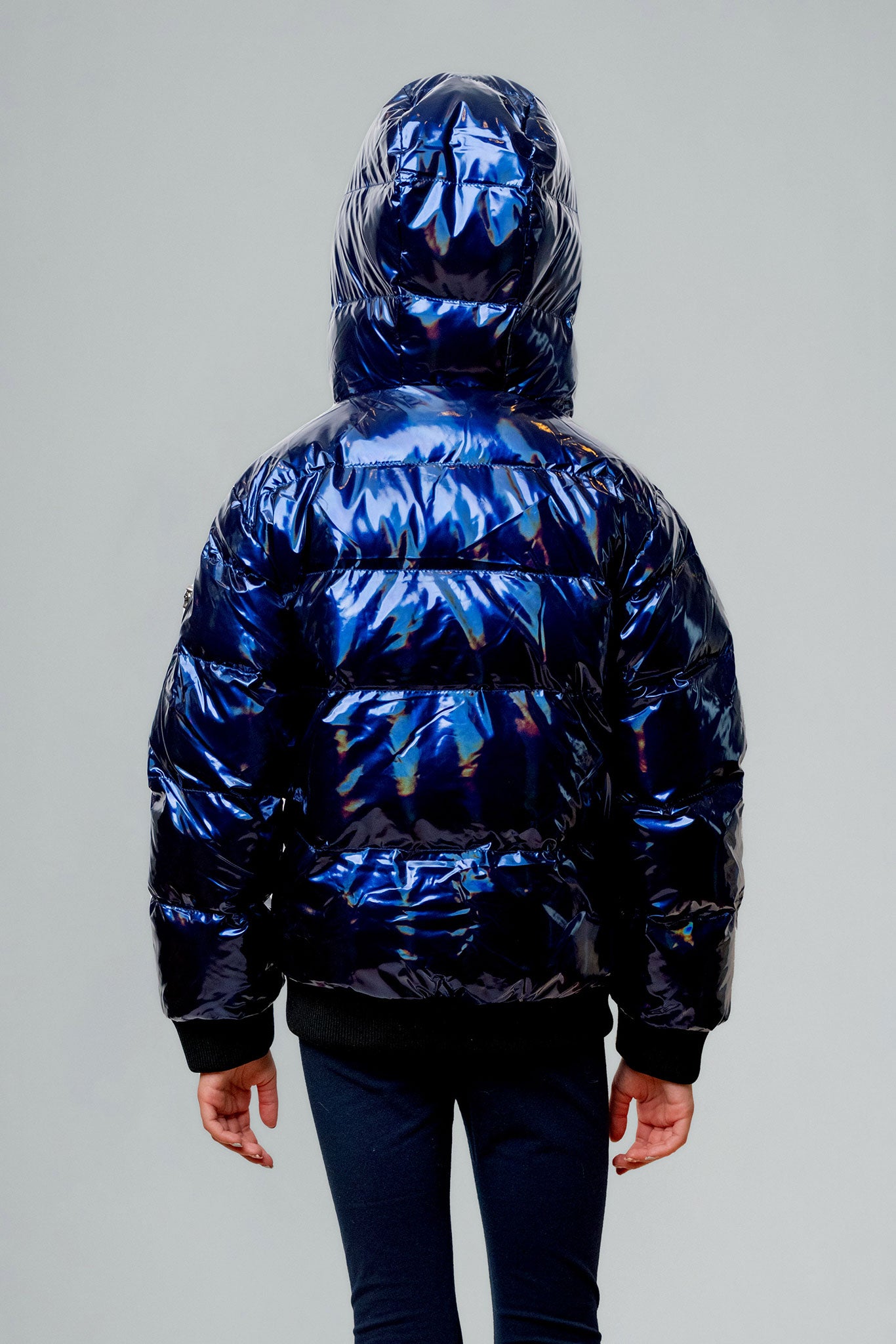 Woodpecker Kids' Chickadee Winter coat. High-end Canadian designer winter coat for Kids in "Oily Blue" colour. Woodpecker cruelty-free winter coat designed in Canada. Kids' heavy weight short length premium designer jacket for winter. Superior quality warm winter coat for kids. Moose Knuckles, Canada Goose, Mackage, Montcler, Will Poho, Willbird, Nic Bayley. Extra warm. Shiny parka. Stylish winter jacket. Designer winter coat.