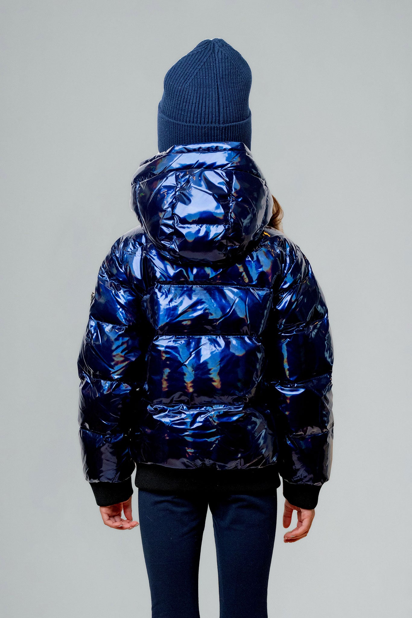 Woodpecker Kids' Chickadee Winter coat. High-end Canadian designer winter coat for Kids in "Oily Blue" colour. Woodpecker cruelty-free winter coat designed in Canada. Kids' heavy weight short length premium designer jacket for winter. Superior quality warm winter coat for kids. Moose Knuckles, Canada Goose, Mackage, Montcler, Will Poho, Willbird, Nic Bayley. Extra warm. Shiny parka. Stylish winter jacket. Designer winter coat.