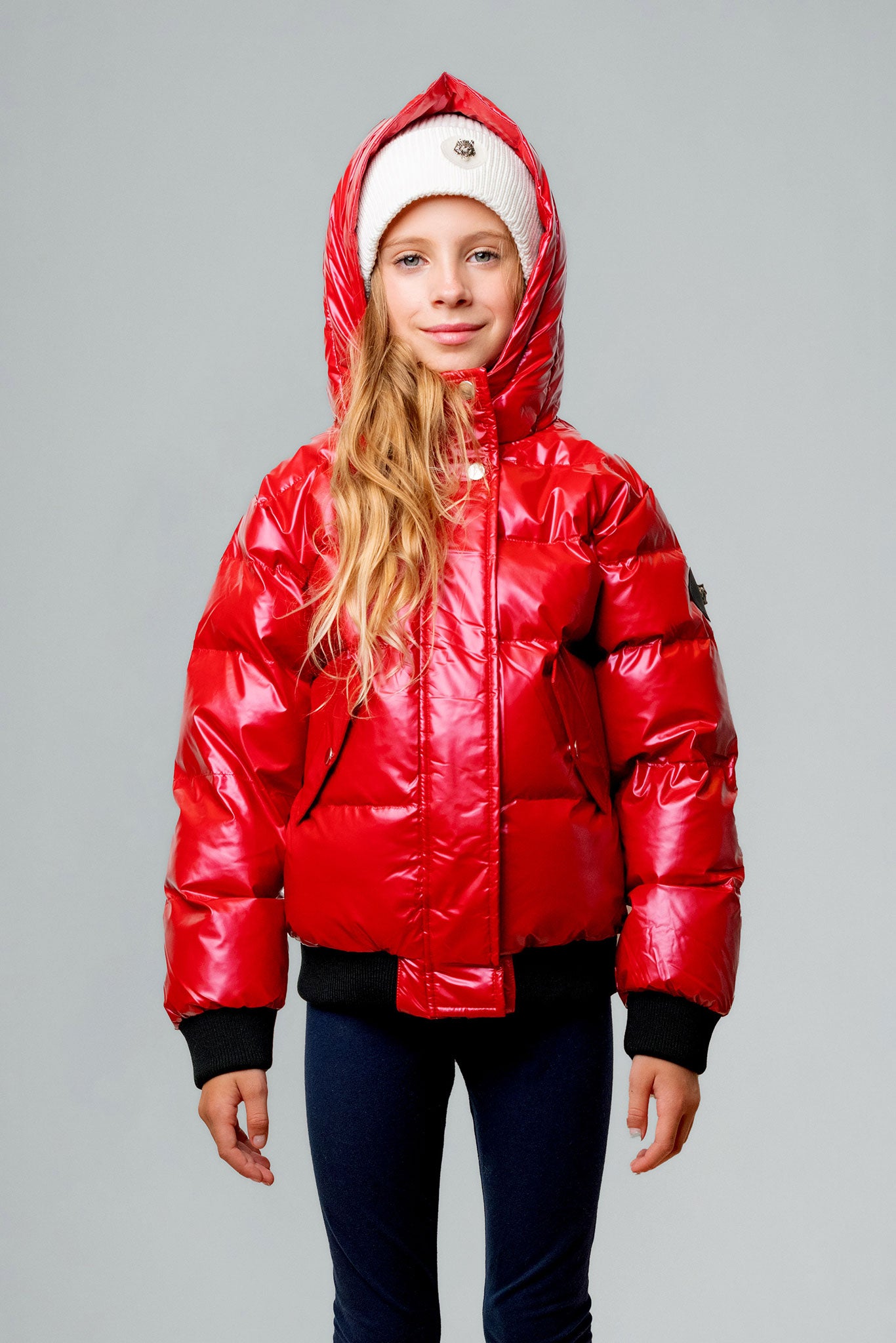 Woodpecker Kids' Chickadee Winter coat. High-end Canadian designer winter coat for Kids in "Raspberry" colour. Woodpecker cruelty-free winter coat designed in Canada. Kids' heavy weight short length premium designer jacket for winter. Superior quality warm winter coat for kids. Moose Knuckles, Canada Goose, Mackage, Montcler, Will Poho, Willbird, Nic Bayley. Extra warm. Shiny parka. Stylish winter jacket. Designer winter coat.