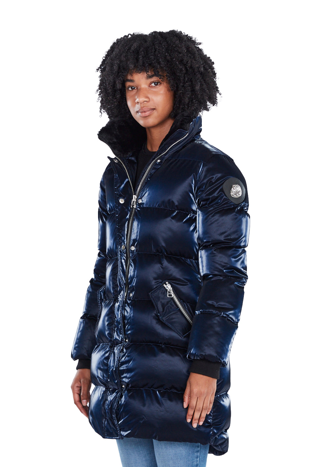 Woodpecker Women's Penguin Long Winter coat. High-end Canadian designer winter coat for women in shiny "All Wet Navy" blue colour. Woodpecker cruelty-free winter coat designed in Canada. Women's heavy weight long length premium designer jacket for winter. Superior quality warm winter coat for women. Moose Knuckles, Canada Goose, Mackage, Montcler, Will Poho, Willbird, Nic Bayley. Extra warm. Shiny parka. Stylish winter jacket. Designer winter coat.